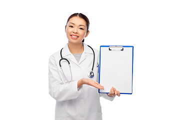 Image showing happy smiling asian female doctor with clipboard