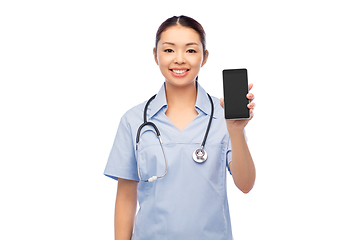 Image showing happy asian female doctor or nurse with smartphone