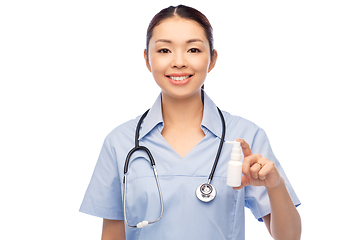 Image showing smiling asian female doctor or nurse with medicine