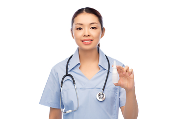 Image showing smiling asian female doctor or nurse with medicine