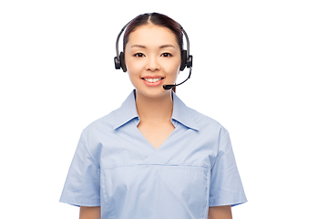 Image showing smiling asian female doctor or nurse in headset