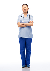 Image showing smiling asian female doctor or nurse in uniform