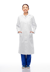 Image showing happy smiling asian female doctor in white coat