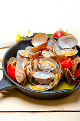 Image showing fresh clams on an iron skillet