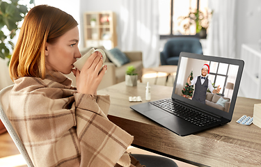 Image showing sick woman having video call with man on christmas