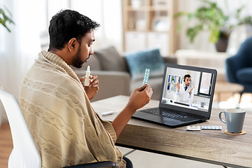 Image showing sick man having video call with doctor on laptop