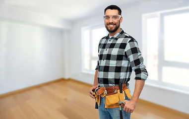 Image showing happy male worker or builder with tool belt