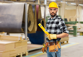 Image showing male worker or builder in helmet with level