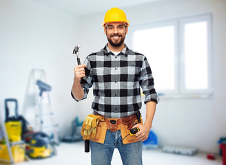 Image showing happy male builder in helmet with hammer