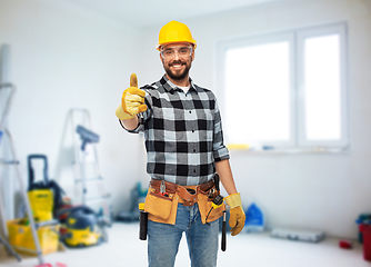 Image showing happy male worker or builder showing thumbs up