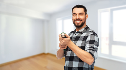 Image showing happy man, worker or builder with drill