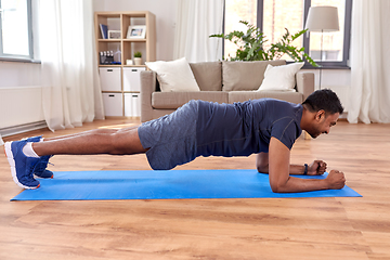 Image showing indian man doing plank exercise at home