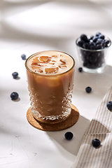 Image showing glass of ice coffee on cork drink coaster