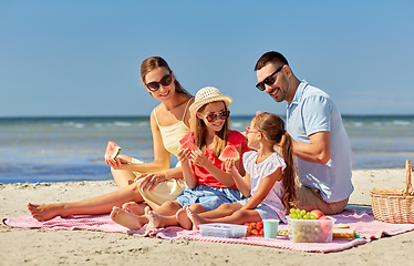 Image showing happy family having picnic on summer beach