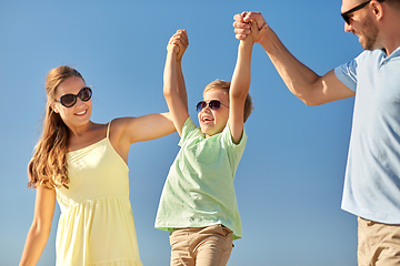 Image showing happy family with child having fun in summer