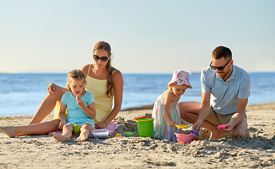 Image showing happy family with children playing on summer beach