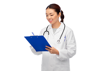 Image showing happy smiling asian female doctor with clipboard