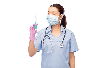 Image showing asian nurse in mask with medicine in syringe