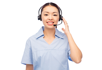 Image showing smiling asian female doctor or nurse in headset