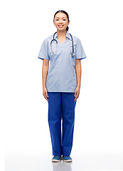 Image showing smiling asian female doctor or nurse in uniform