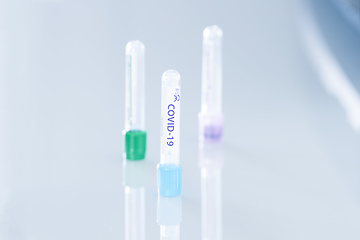 Image showing Covid-19 vaccination tubes on a clinical desk