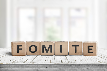 Image showing Fomite sign made of blocks on a wooden table