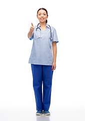 Image showing smiling asian female doctor or nurse in uniform