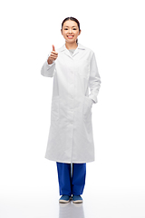 Image showing smiling asian female doctor showing thumbs up