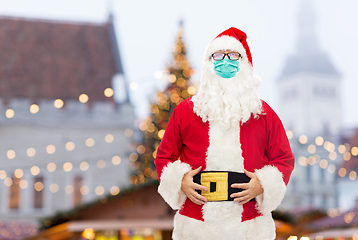 Image showing man in costume of santa claus wearing medical mask