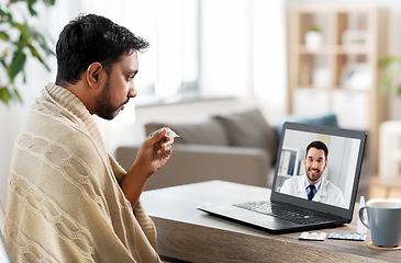 Image showing sick man having video call with doctor on laptop