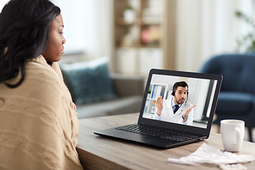 Image showing sick woman having video call with doctor on laptop