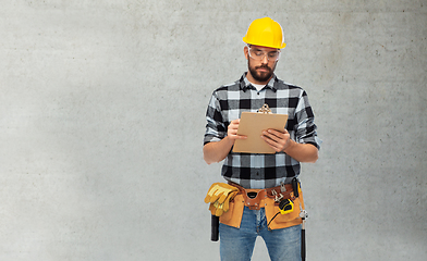 Image showing male worker or builder in helmet with clipboard