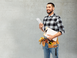 Image showing male builder with clipboard and blueprint