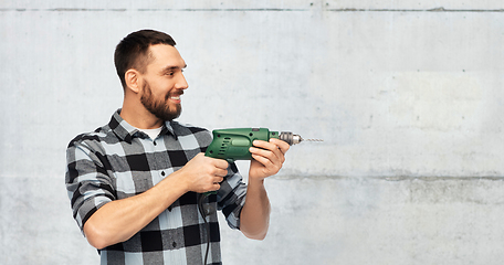 Image showing happy man, worker or builder with drill