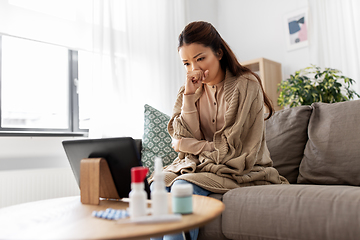 Image showing sick woman having video call on tablet pc at home