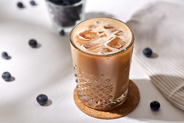 Image showing glass of ice coffee on cork drink coaster