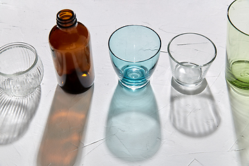 Image showing glassware dropping shadows on white surface