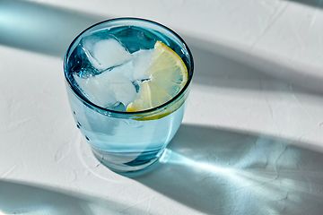 Image showing blue glass of water with lemon and ice