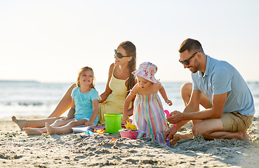 Image showing happy family with children playing on summer beach