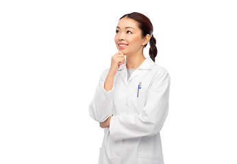 Image showing thinking asian female doctor in white coat