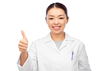 Image showing smiling asian female doctor showing thumbs up