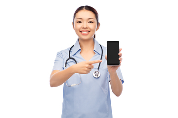 Image showing happy asian female doctor or nurse with smartphone