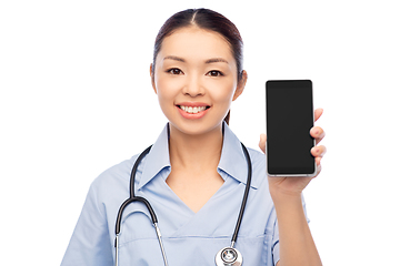 Image showing happy asian female doctor or nurse with smartphone