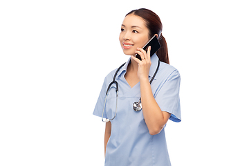 Image showing asian female doctor or nurse calling on smartphone