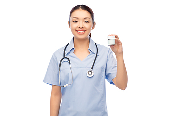 Image showing smiling asian female doctor or nurse with medicine