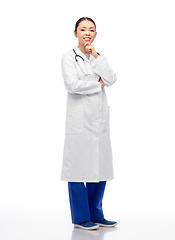 Image showing thinking asian female doctor in white coat