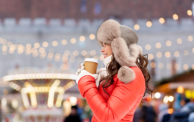Image showing happy woman drinking coffee at christmas market