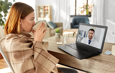 Image showing sick woman having video call with doctor at home