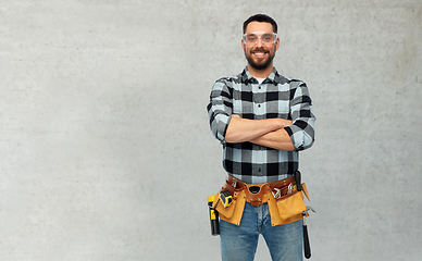 Image showing happy male worker or builder with crossed arms