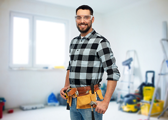 Image showing happy male worker or builder with tool belt